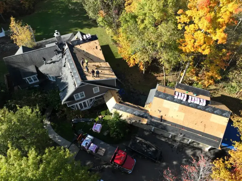 Nailed Down Roofing crew installing new roof on residential home in Akron Ohio