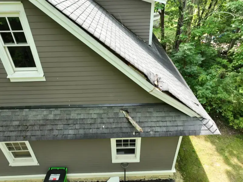Tree branch damage to residential roof from storm and wind in Ohio